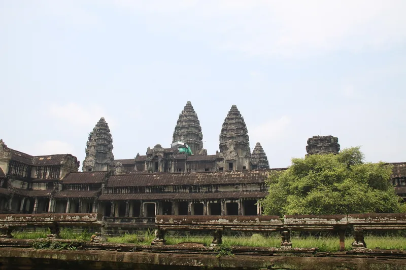 The stone towers of Angkor Wat rise above ancient galleries and greenery near Siem Reap.